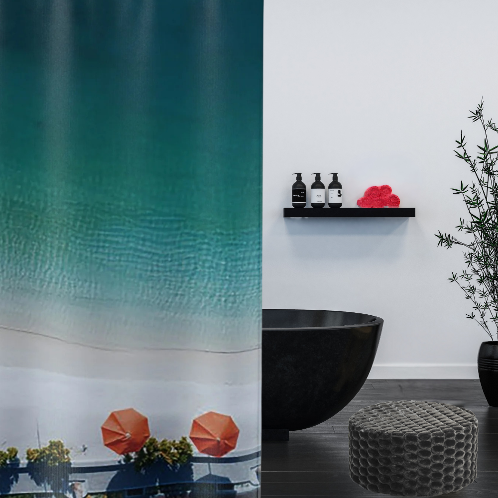 An ombre blue shower curtain with bright orange umbrellas shown with a black tub in a luxe bathroom