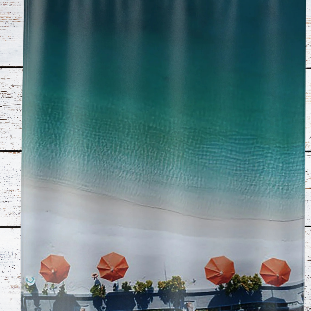 detail of umbrellas on the beach shower curtain with fading blue background and vivid orange beach umbrellas