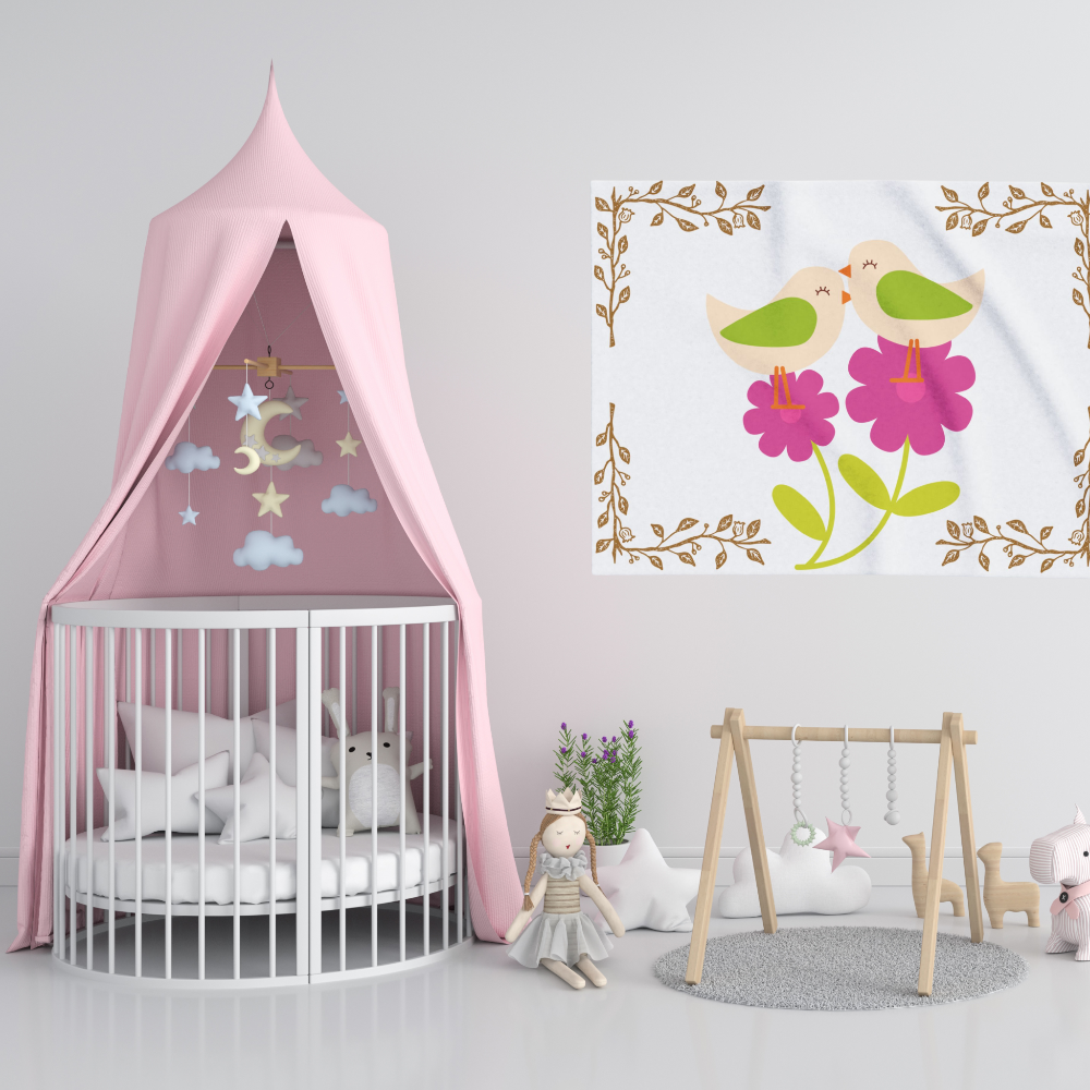 White blanket with bright pink blossoms and adorable little birds shown in a lovely nursery
