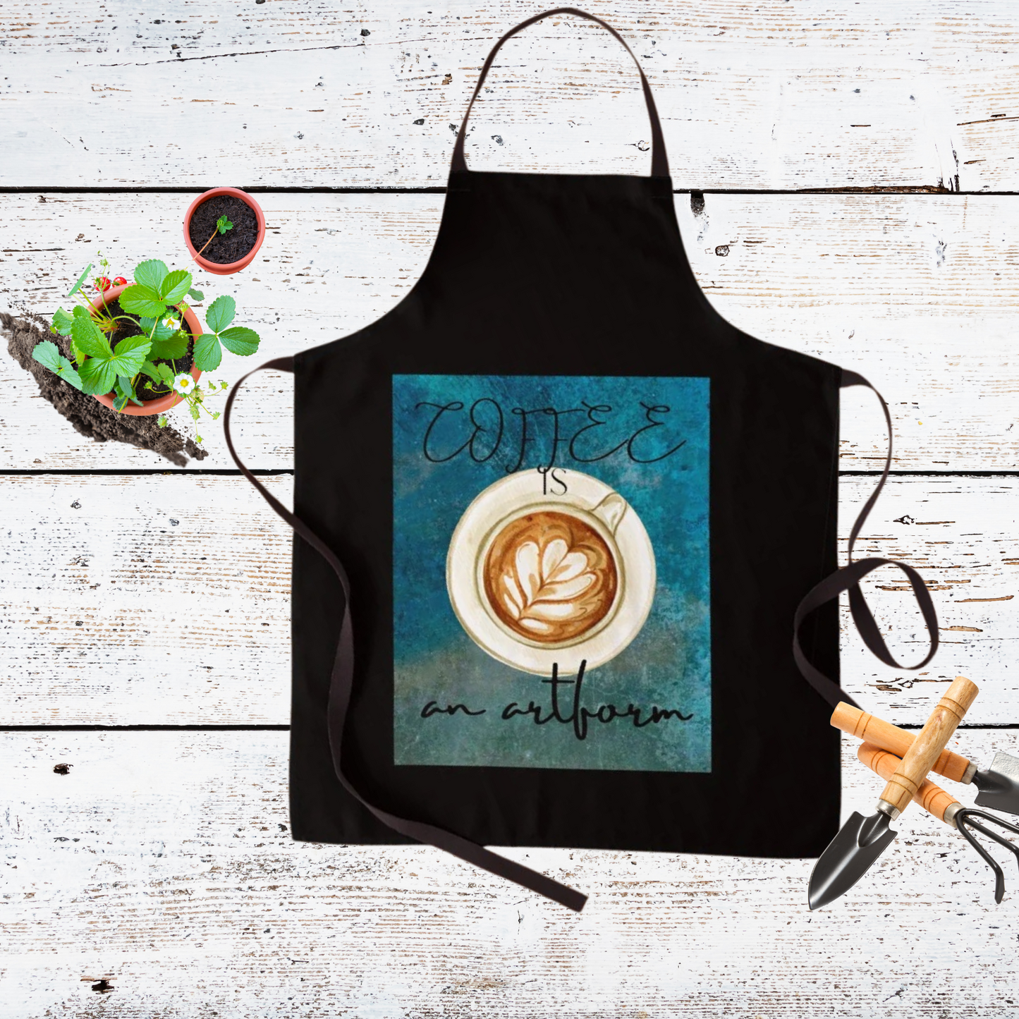 Black and teal apron with decorative coffee shown with gardening tools