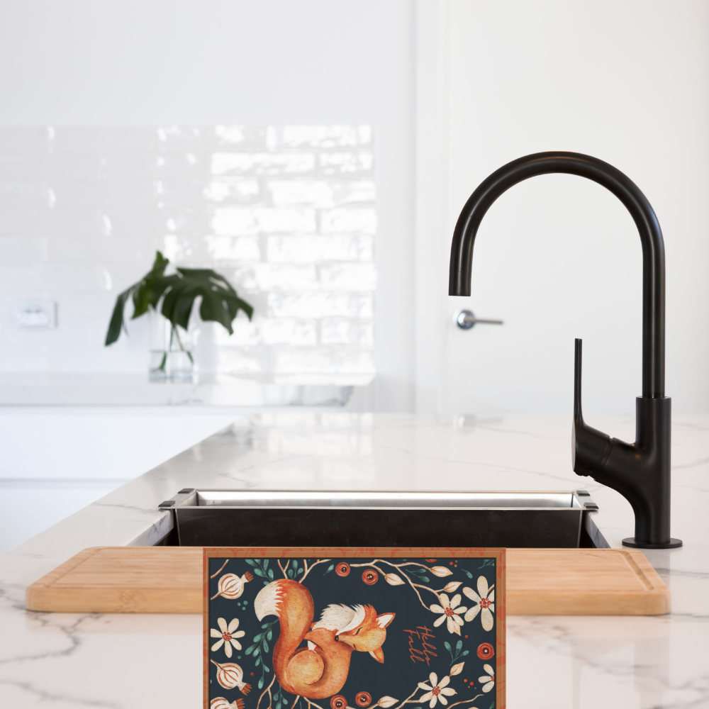 shown in a kitchen by a faucet