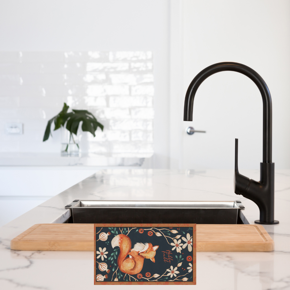 Shown in a kitchen by a sink with a black faucet