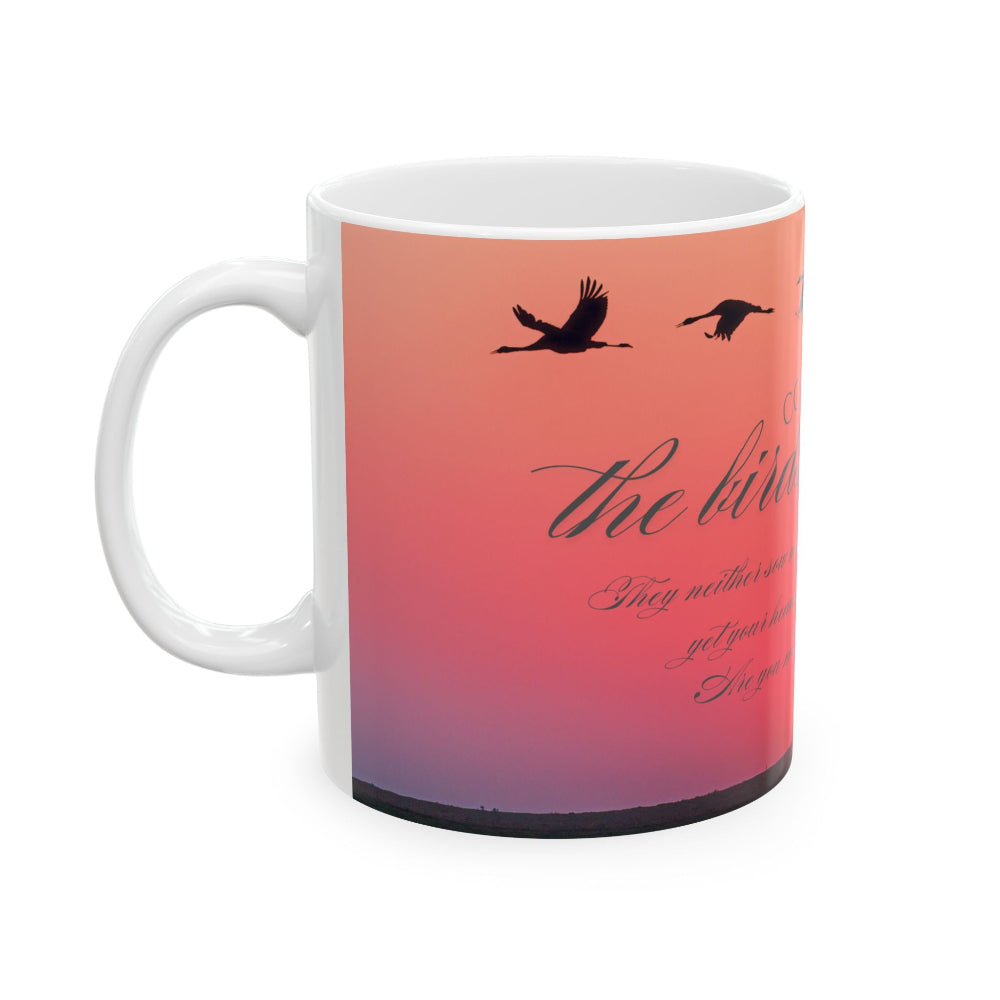 Ceramic mug with gradient sunset design, flying ducks and bible text on a white background