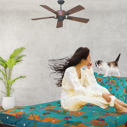 Vibrant Floral Comforter shown in a bedroom with a woman and a kitten