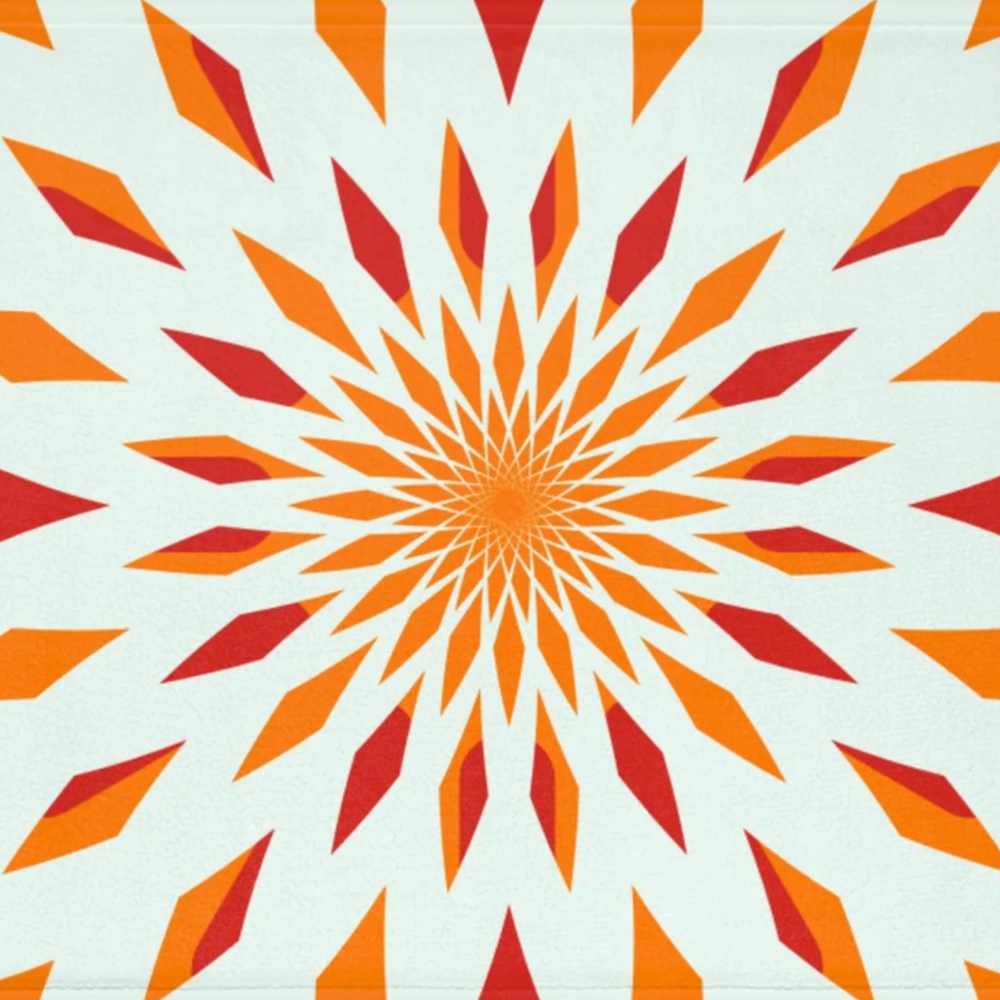 small rug with vivid shades of orange on a white background