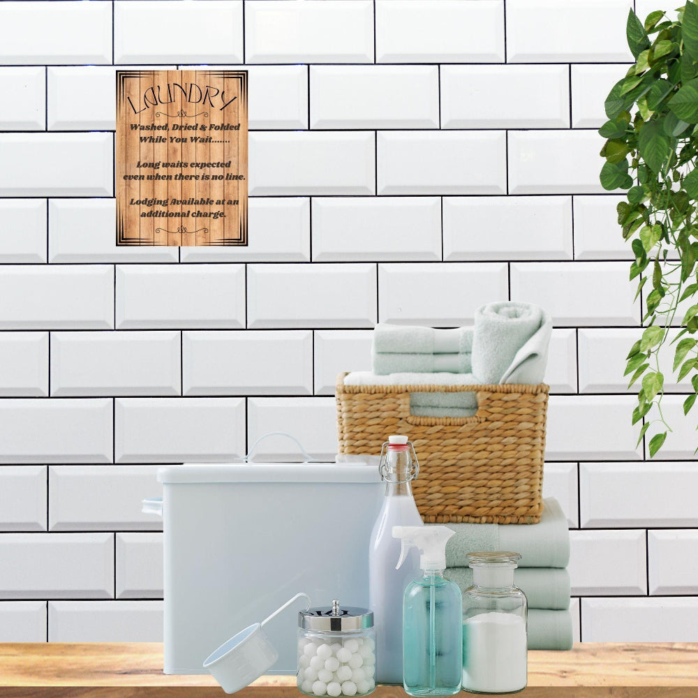 Laundry Room Decor wall art print shown in Wood tone on a white tile wall