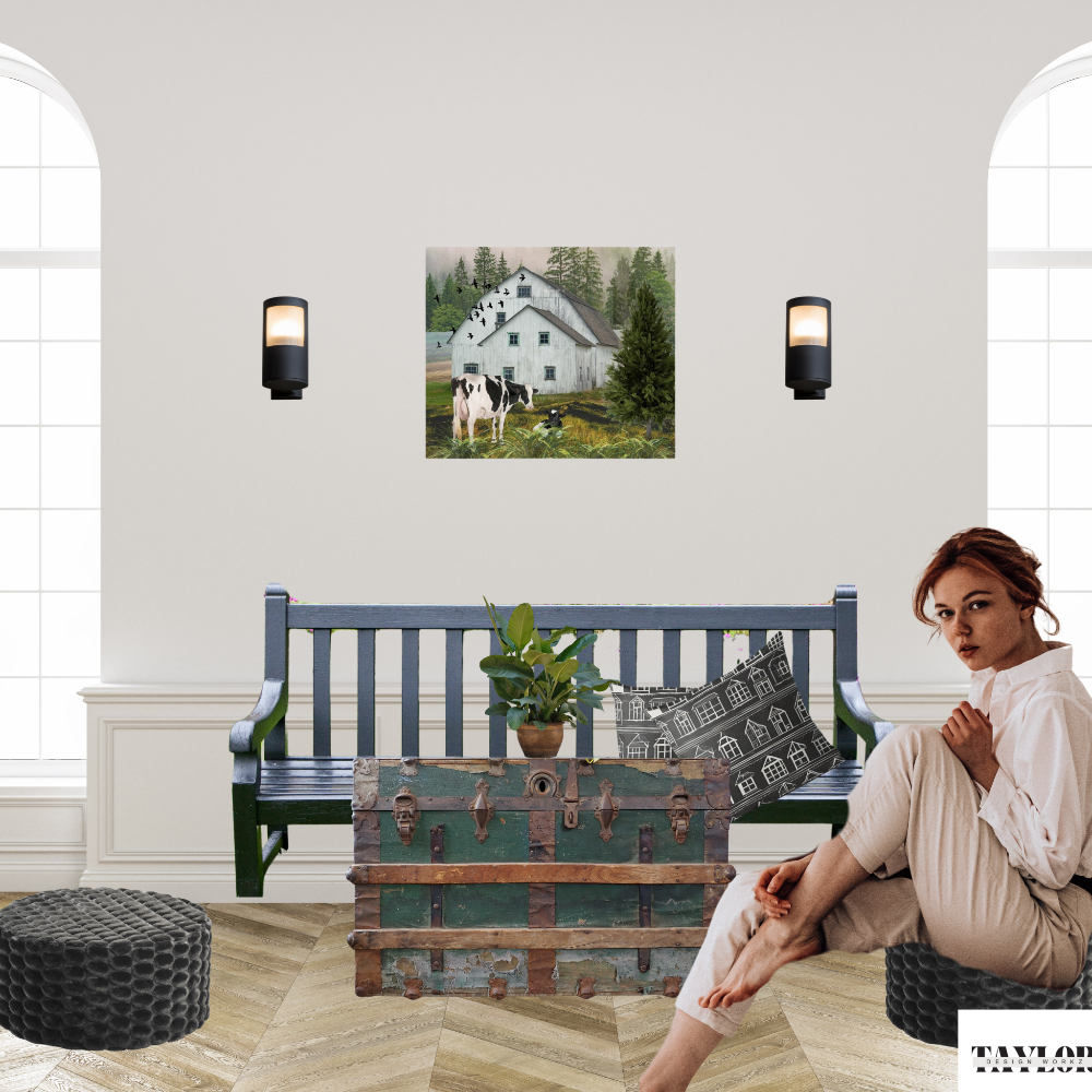 Nostalgic Barn landscape art with black and white Holstein cows shown with a woman in a living room setting