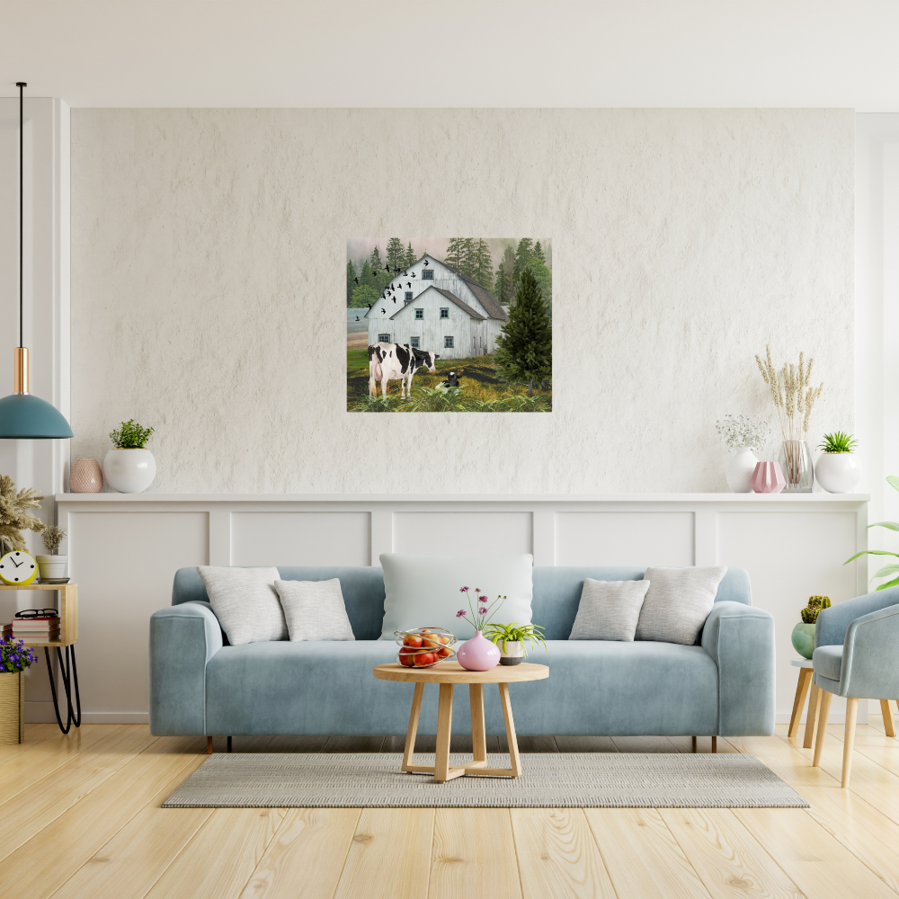 Nostalgic Barn landscape art with black and white Holstein cows shown over a blue couch