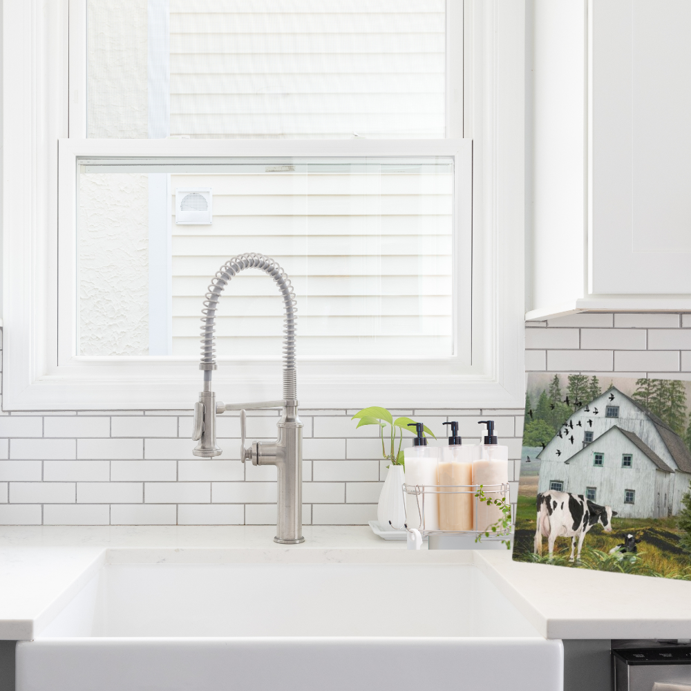 Nostalgic Barn landscape art with black and white cows shown in a modern kitchen setting