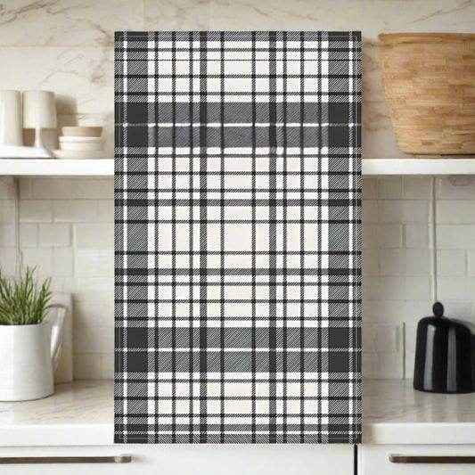 Black and white plaid pattern tea towel shown on a white background