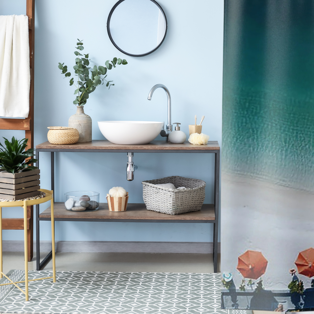 Fading from dark blue at the top to sand color at the bottom with bright orange umbrellas shown in a blue bathroom