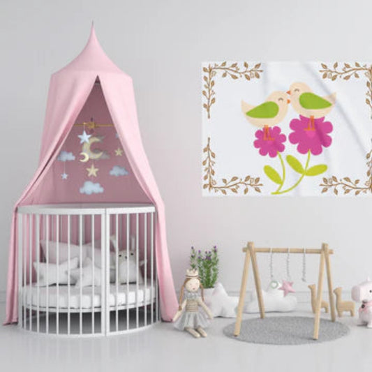 Adorable birds perched on bright pink flowers adorn this soft fleece baby blanket, shown hanging in a nursery with a round crib and pink canopy.