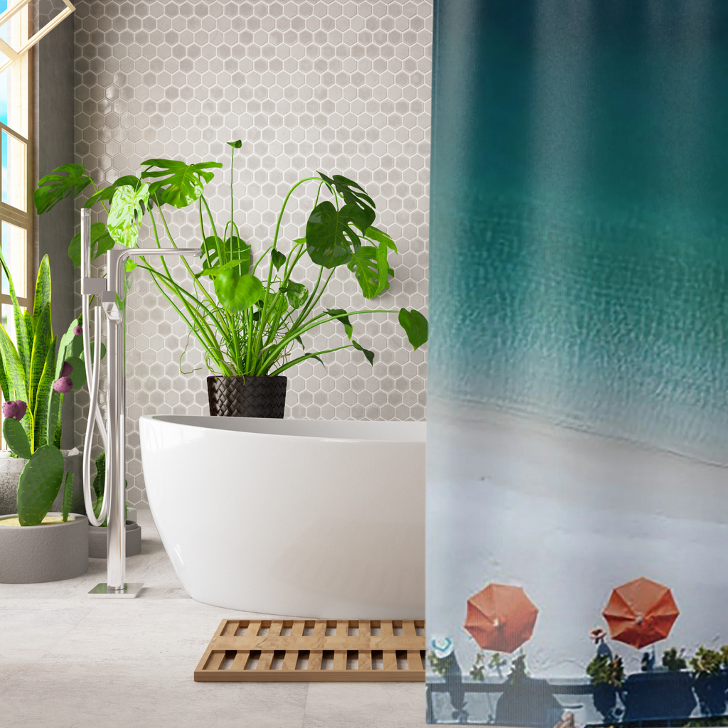 an ombre blue shower curtain with orange beach umbrellas shown in a luxury bathroom