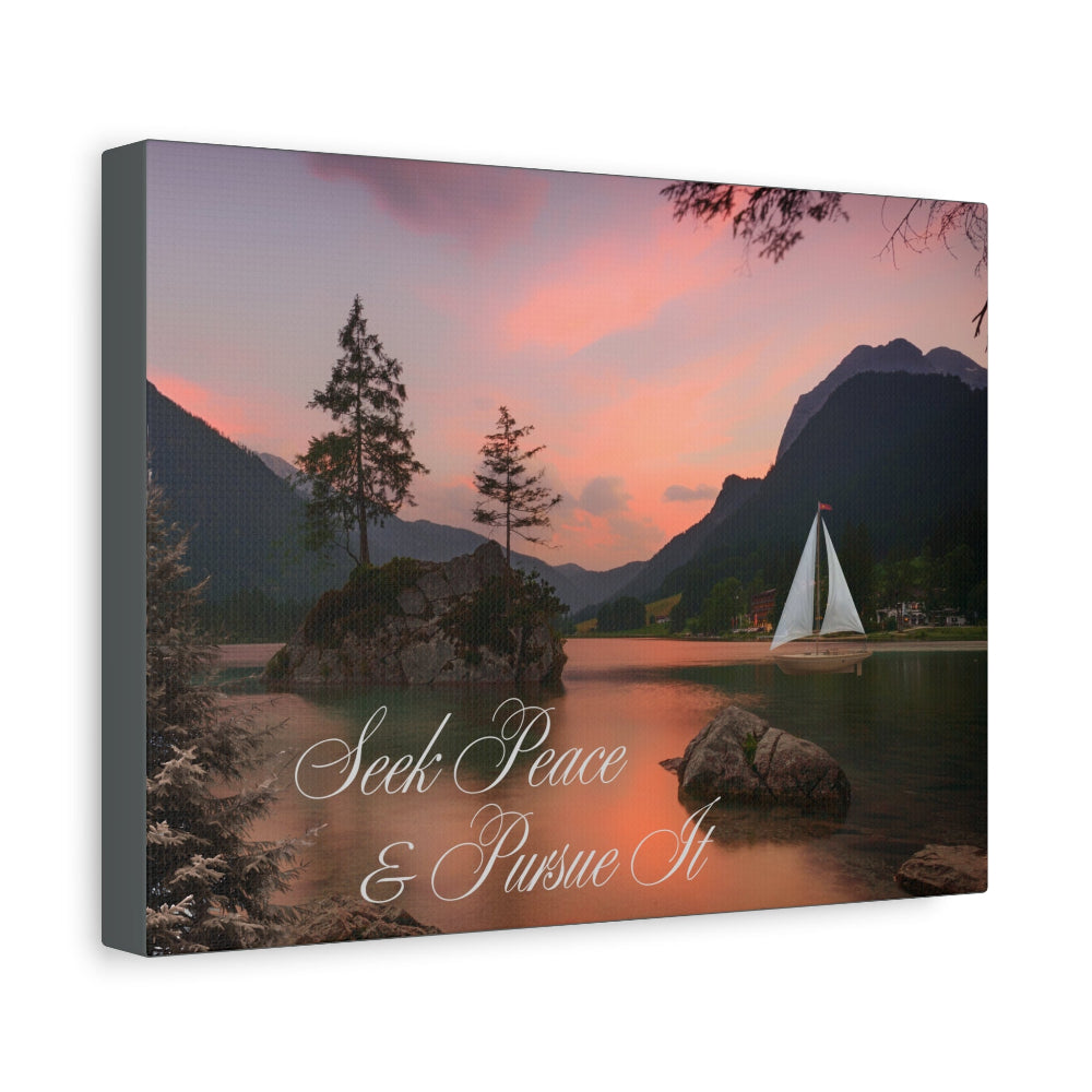 Canvas print with a scenic landscape of a lake, sailboat, and mountains at sunset with text 'Seek Peace & Pursue It'.
