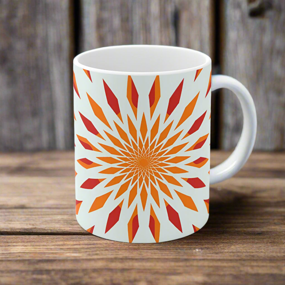 White mug with a colorful geometric pattern on a white background