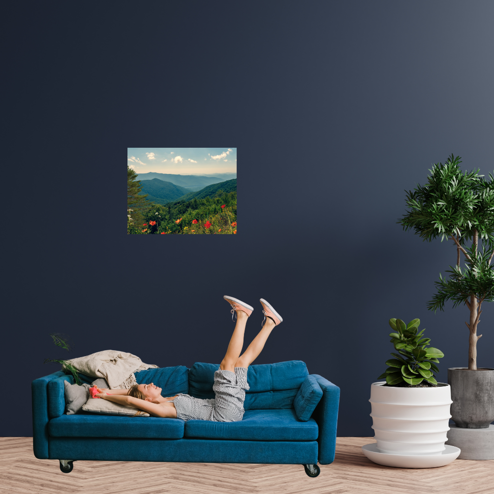 A Beautiful Day Mountain Landscape art shown in a living room with a girl on a blue sofa