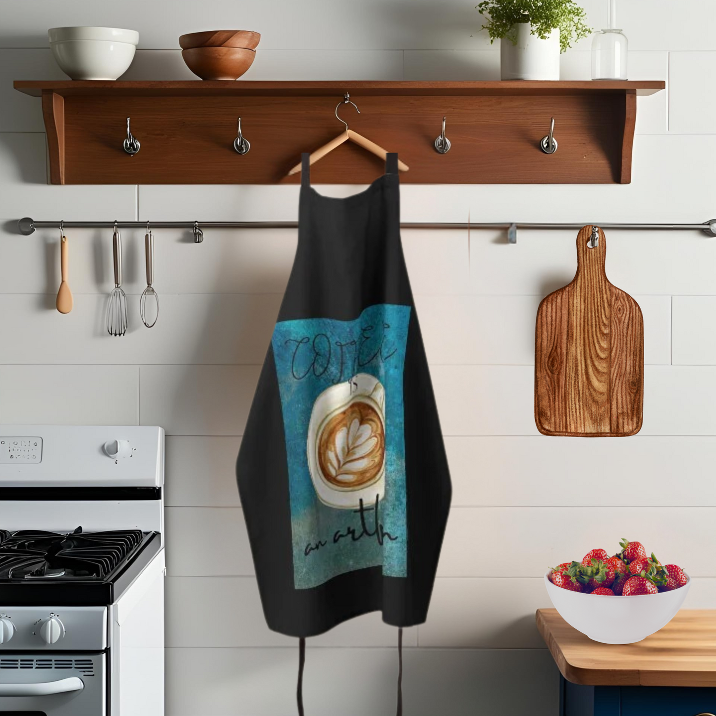Black and Teal apron with cappucccino cup with decorative foam hanging in a kitchen