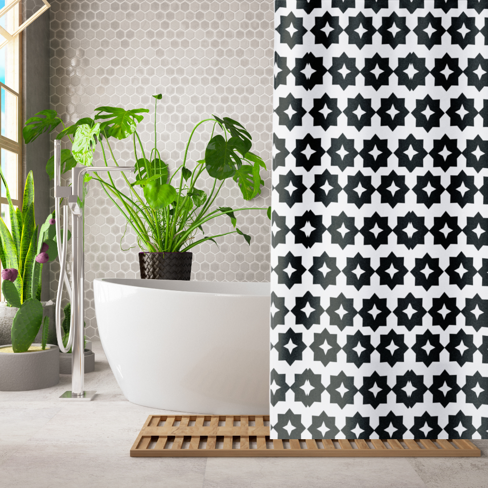 A black and white geometric patterned shower curtain shown in a bathroom setting