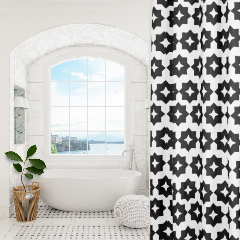 A black and white geometric patterned shower curtain shown in an elegant bathroom