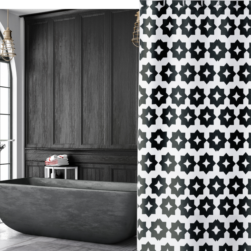 black and white geometric shower curtain in a moody dark bathroom