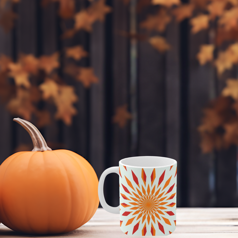 orange starburst mug shown in a fall setting
