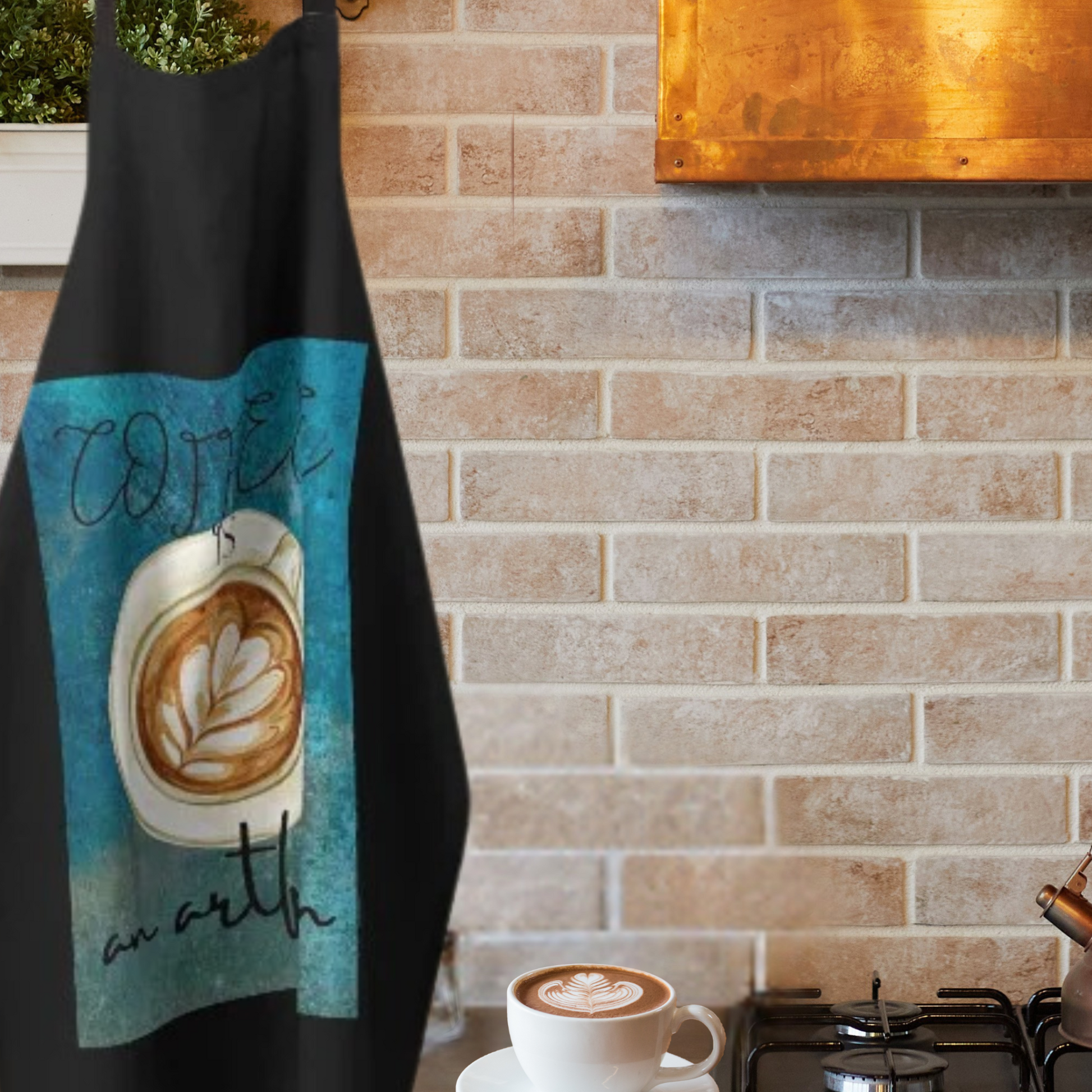 black and teal apron with deorative coffee hanging in kitchen with copper rangehood