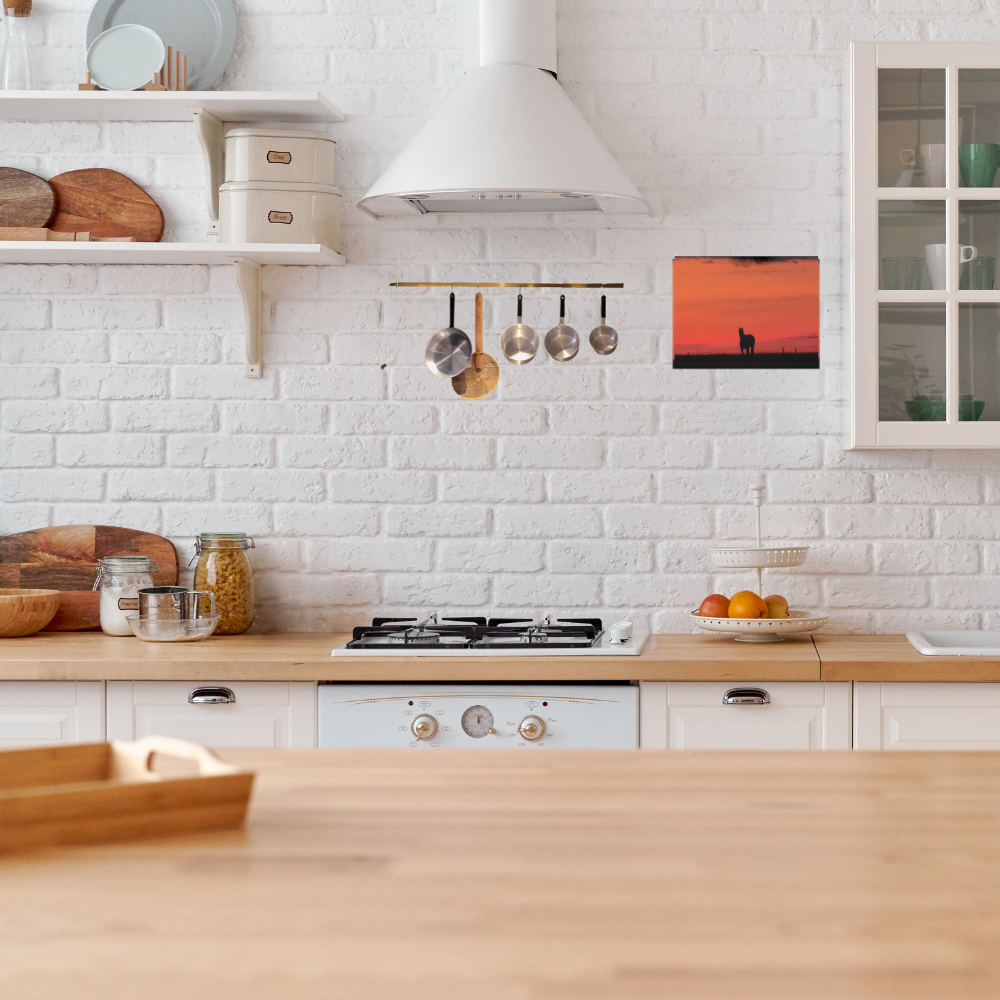 Silhouette of a horse at sunset shown in a modern farmhouse style kitchen 