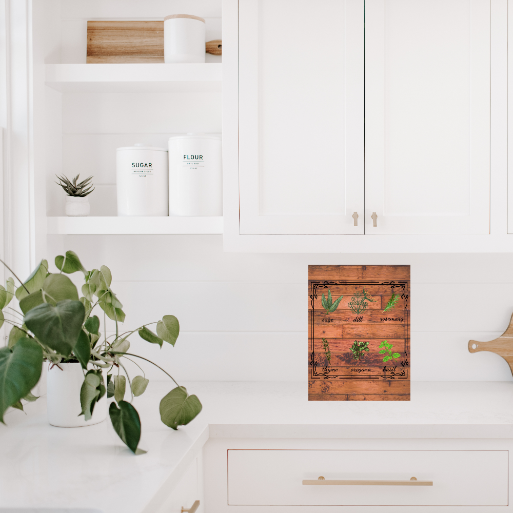 Rustic Herb Chart shown in a Kitchen with white cabinets, a plant, and a wooden cutting board 