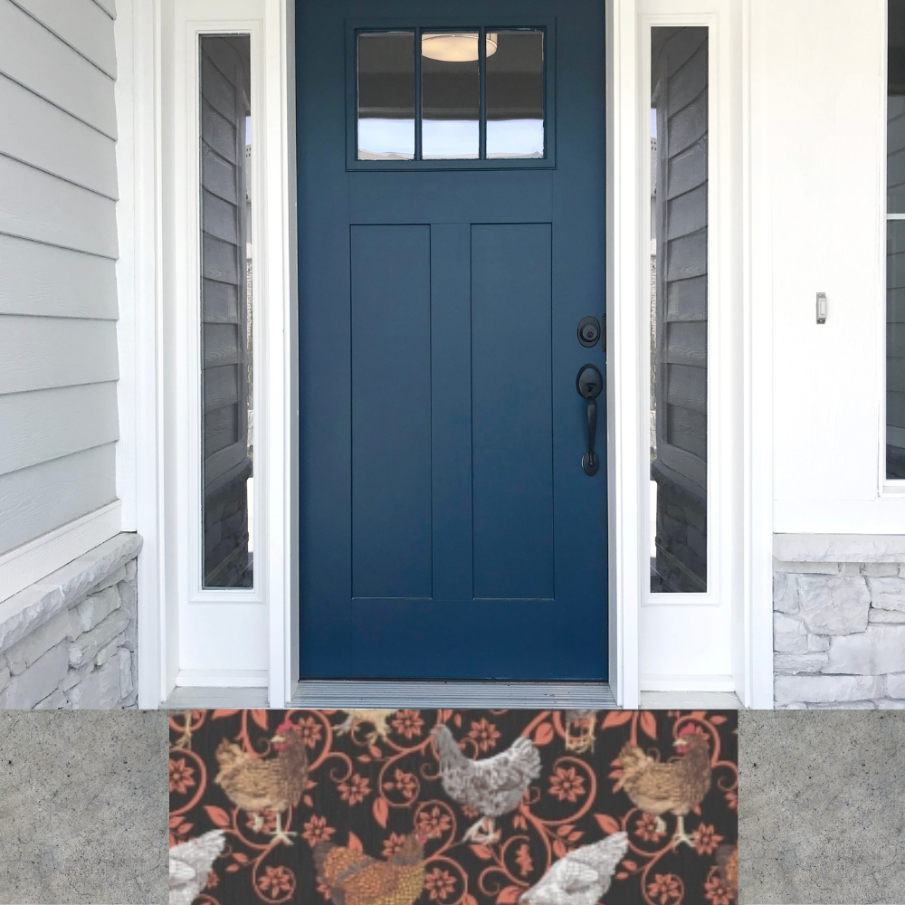 Chicken Outdoor Rug shown in front of a dark blue front door
