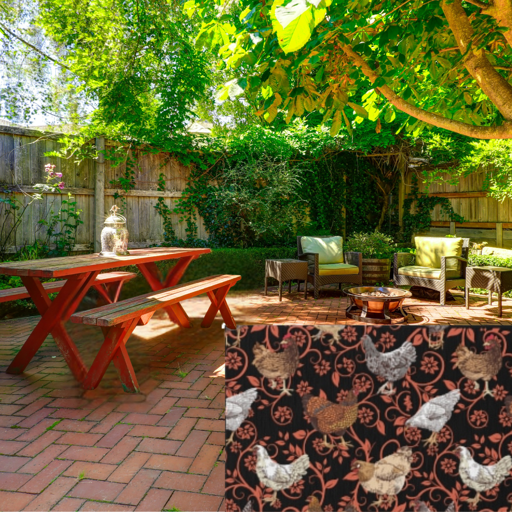 Backyard setting with picnic table, chairs, and a decorative chicken-patterned rug.