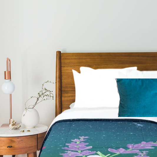 Garden in Moonlight comforter shown in a cozy bedroom with a table and lamp