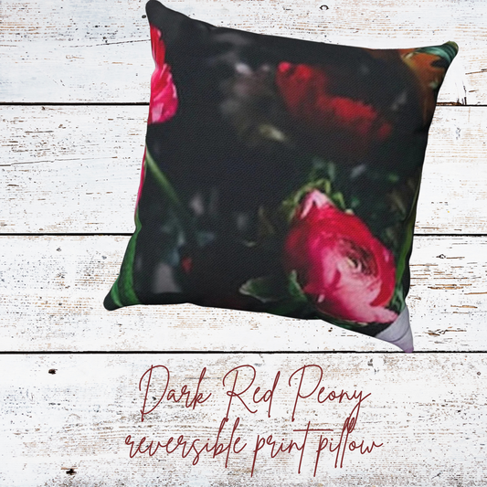 deep toned pillow with bright pink peonies on a white wood background