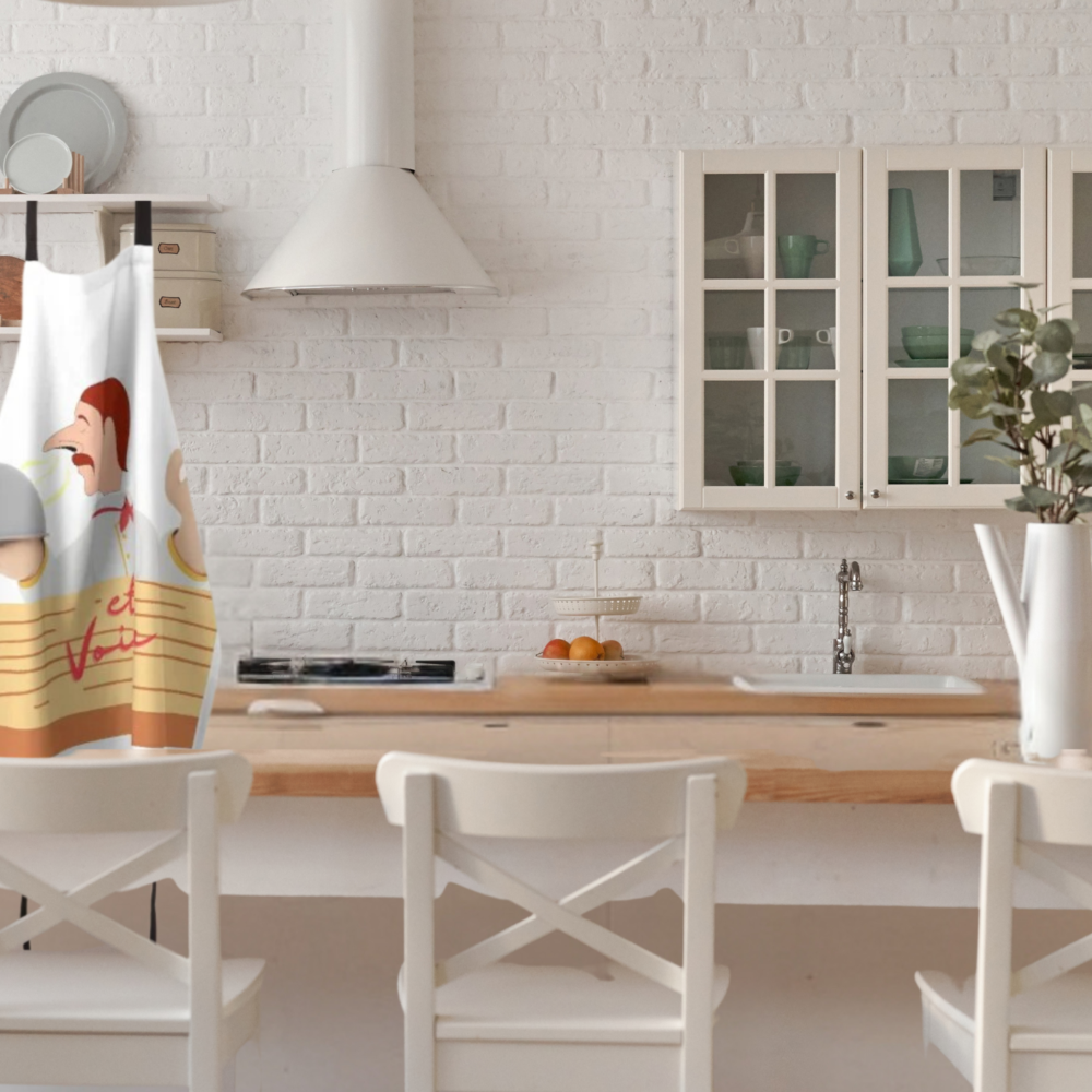 Et Voila French Chef Apron with classic French design shown in a white modern farmhouse style kitchen