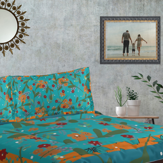 Vibrant Floral Comforter shown in a bedroom with matching pillow sham and decor items