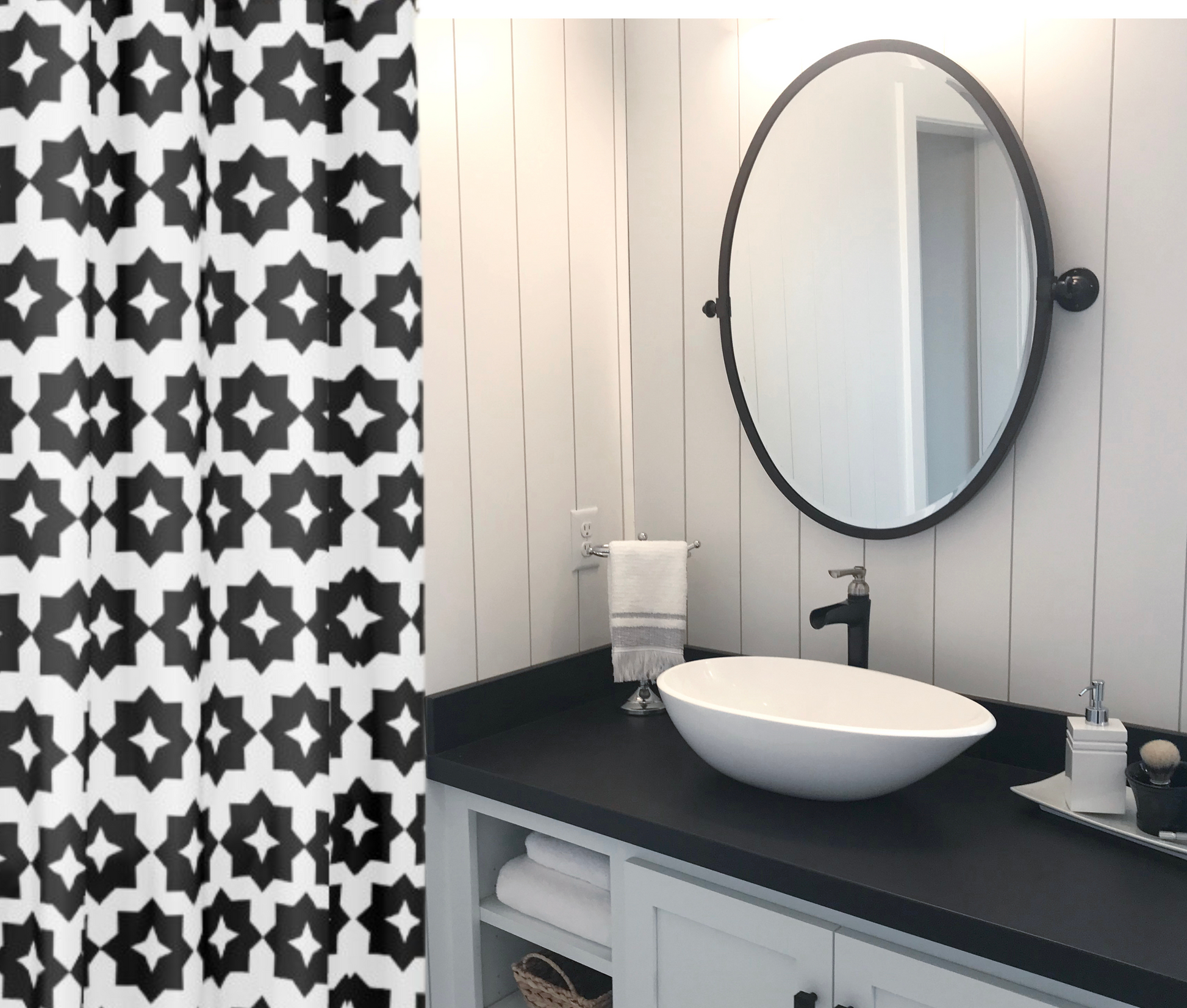 A black and white geometric patterned shower curtain shown in a black and white bathroom