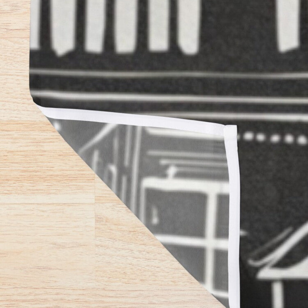 Detail of Home Sweet Hone shower curtain with little white houses on a black background
