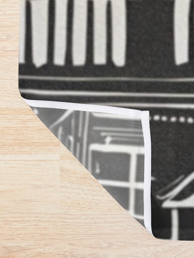 Detail of Home Sweet Hone shower curtain with little white houses on a black background
