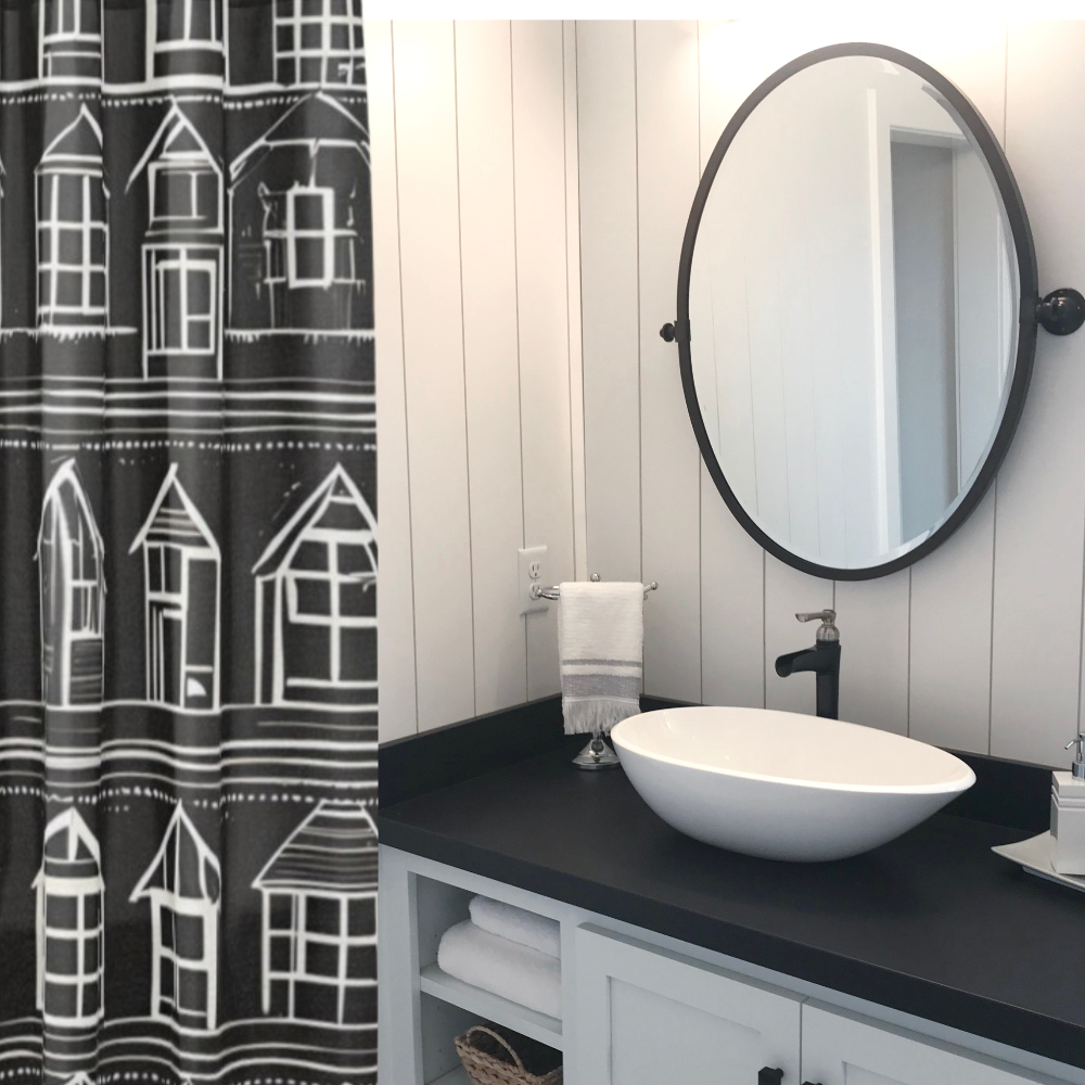 Home Sweet Home Shower Curtain shown in a black and white bathroom.