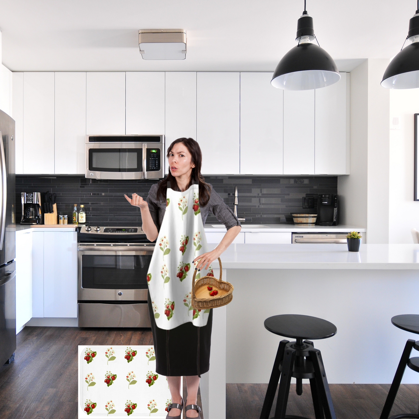 Image of a woman with an almost empty basket of strawberries standing by the fridge on a strawberry print rug wearing matching apron