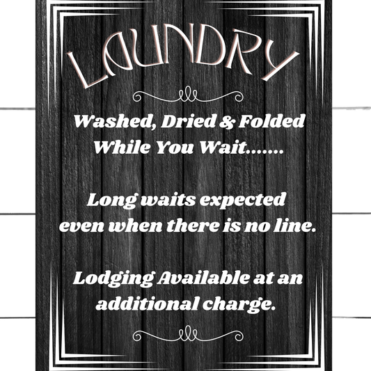 Small Laundry sign that reads Laundry washed while you wait