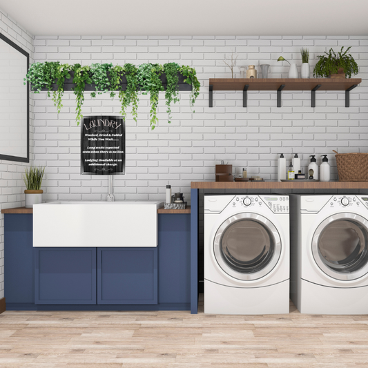 Acrylic Wall Art Laundry while you wait shown in a Modern laundry room with blue cabinets, washing machines, shelves, and plants.