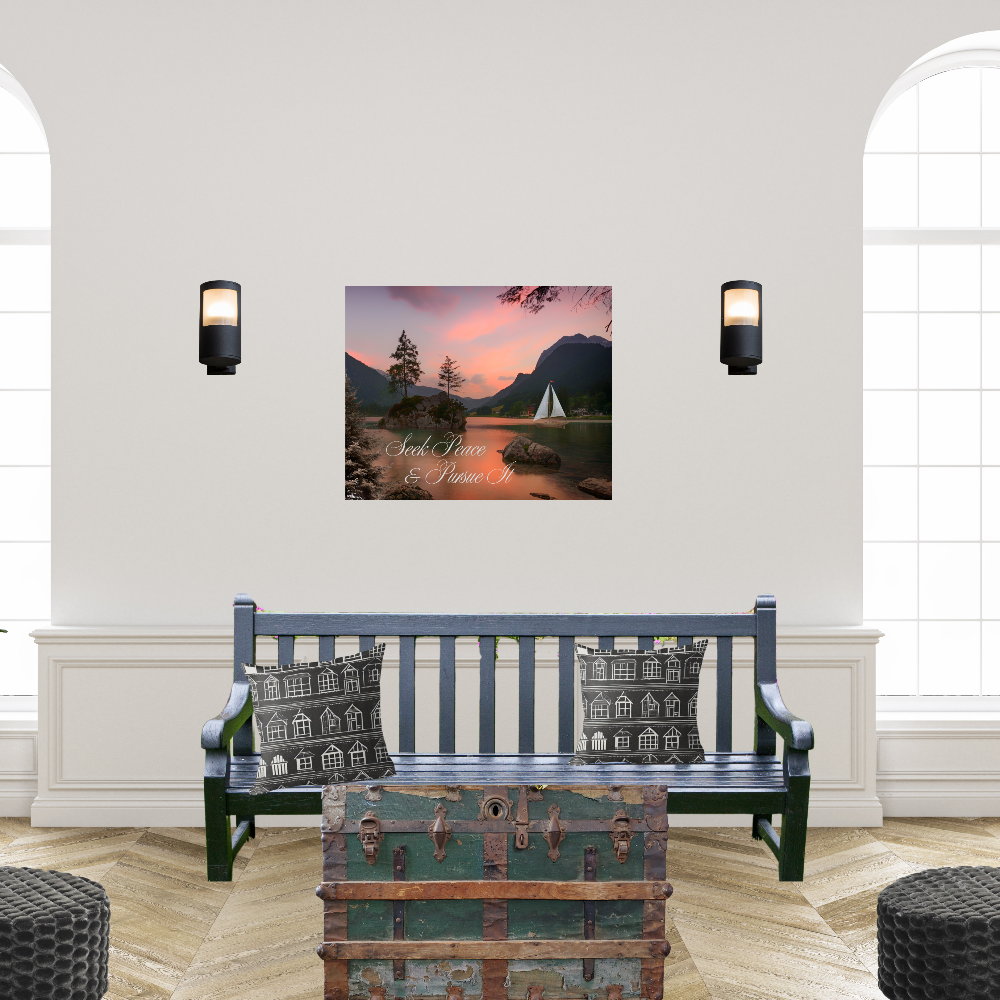 Room interior with a bench, decorative trunk, and wall art of a scenic landscape with a sailboat and the text Seek Peace and Pursue It.