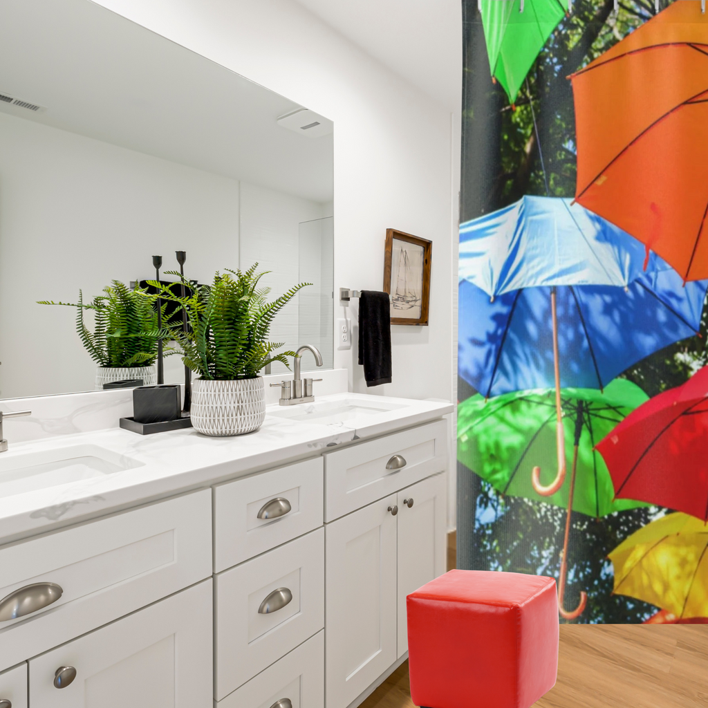 shown in a white bathroom with a red stool and a green plant
