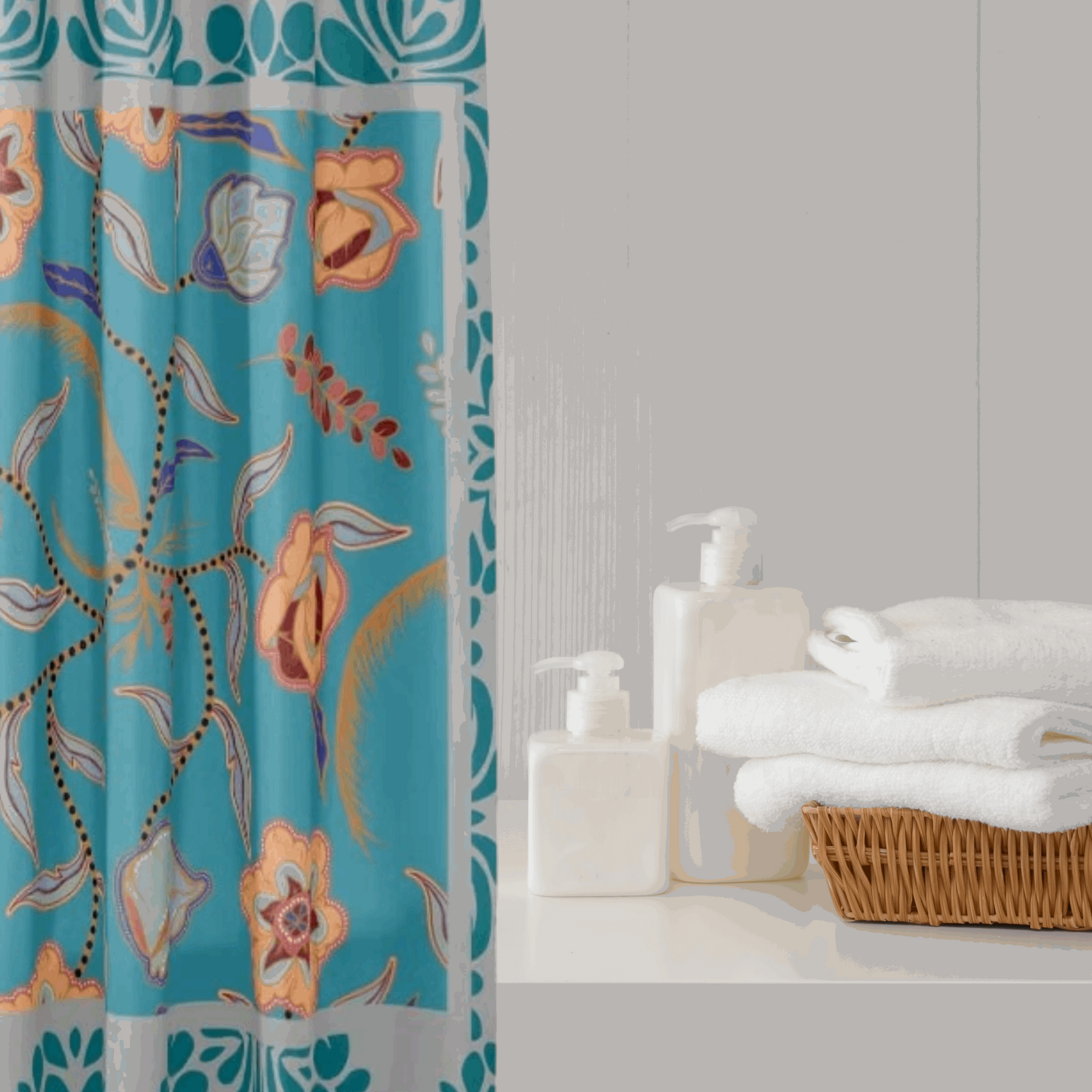 teal and gray floral shower curtain shown with bath supplies