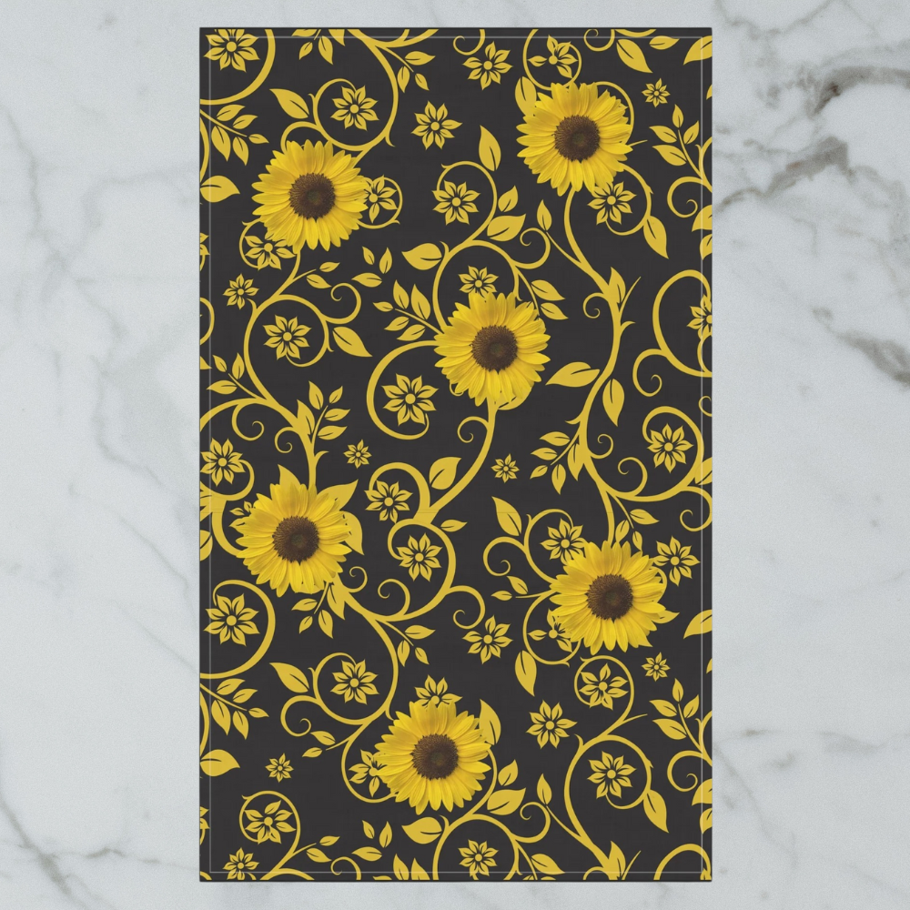 Sunflower Patterned Tea Towel shown in detail on a white marble background