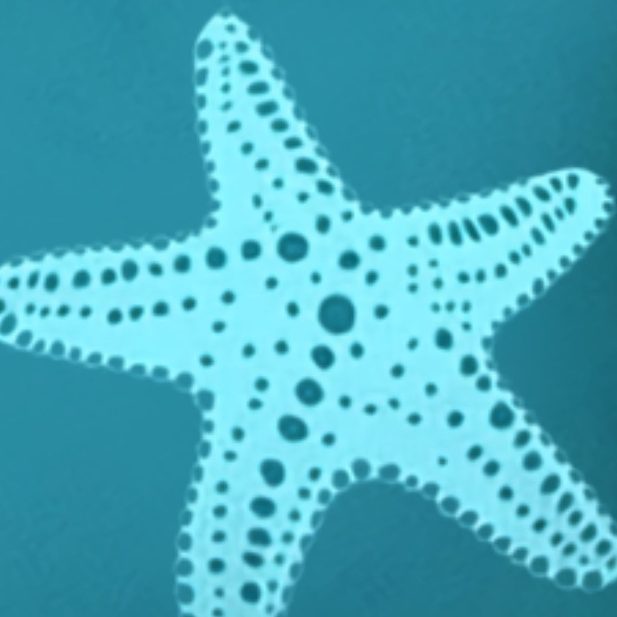 closeup of fabric pillow with a light blue starfish design with dark blue spots on a teal blue background.