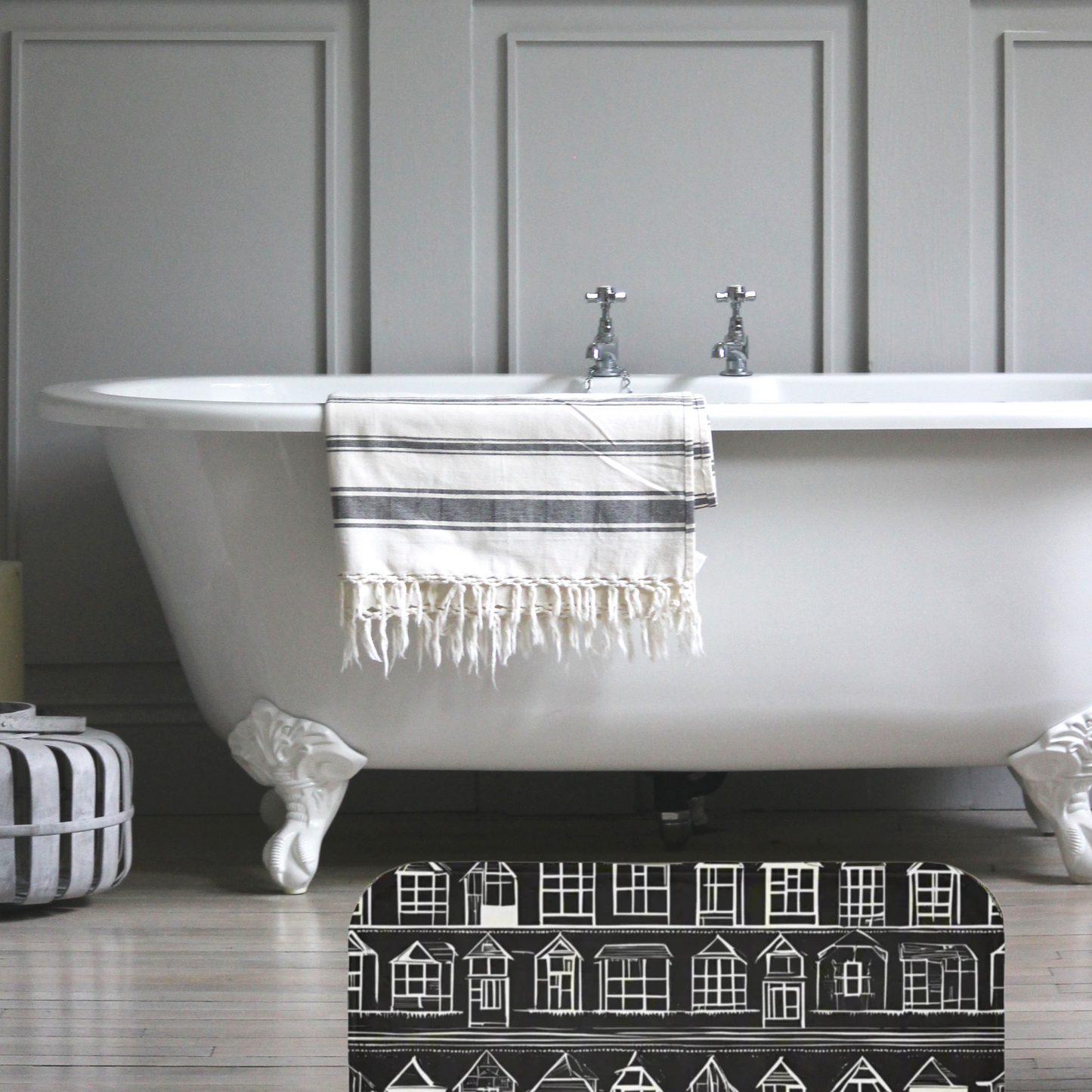 Farmhouse Rug Home Sweet Home by Taylor Design Workz  featuring a black rug with  little white houses in  front of a beautiful bathtub.