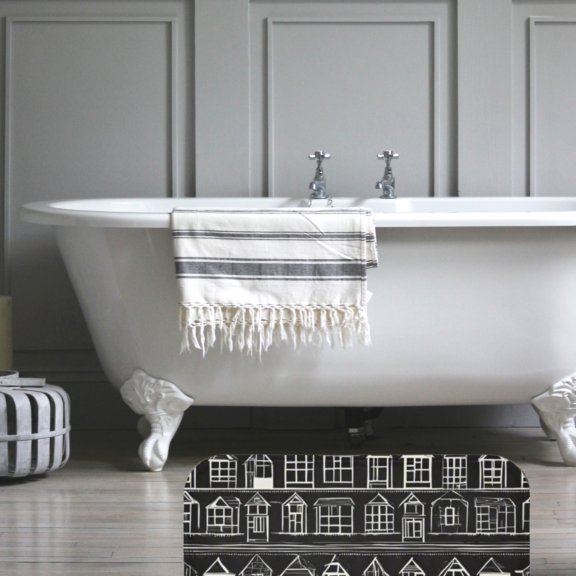 Farmhouse Rug Home Sweet Home by Taylor Design Workz  featuring a black rug with  little white houses in  front of a beautiful bathtub.
