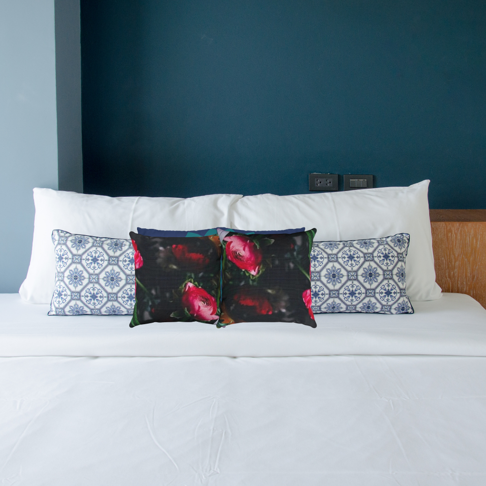 shown in a bedroom with contrasting blue pillows