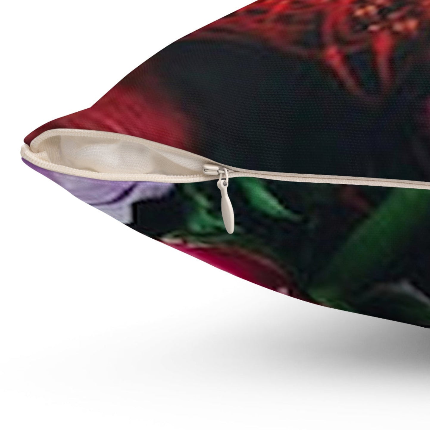 Close-up of a pillow with a zipper, featuring a colorful design.